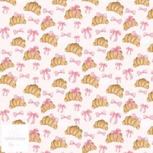 May include: A repeating pattern of watercolor croissants and pink bows on a light pink background. The croissants are golden brown, and the bows are tied on top of some of the croissants. The design is whimsical and suitable for various applications.