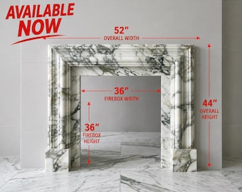 May include: A white marble fireplace mantel with grey veining. The mantel has an overall width of 52 inches and an overall height of 44 inches. The firebox opening measures 36 inches in width and 36 inches in height. The text AVAILABLE NOW is visible.