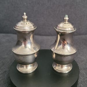 A lovely pair of vintage silver-plated salt and pepper shakers