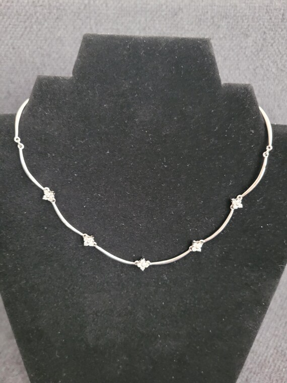 Three vintage jewelry pieces with refined sparkle. View 5