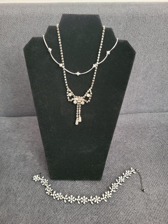 Three vintage jewelry pieces with refined sparkle.