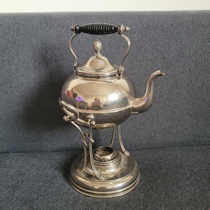 Elegant vintage stainless steel kettle with warmer