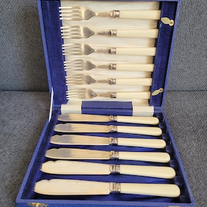 Vintage silver-plated fish knives and forks set.