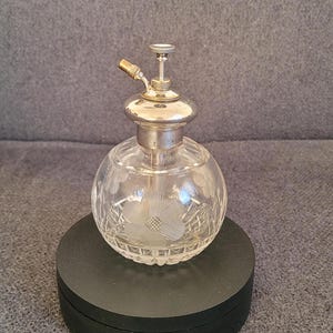 Antique large perfume bottle with silver rim