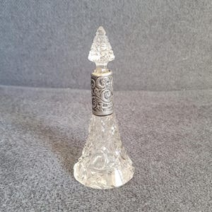 Antique crystal perfume bottle with silver collar