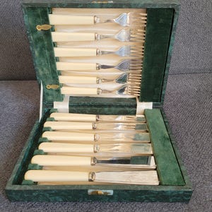 Vintage silver-plated fish knife and fork set.