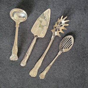 Antique set of 4 silver-plated serving utensils made in England.