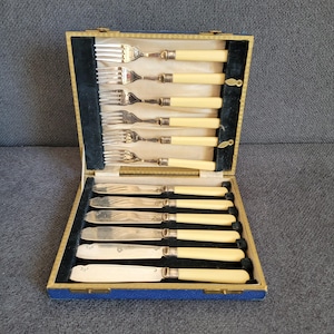 Vintage silver-plated fish knives and forks set.