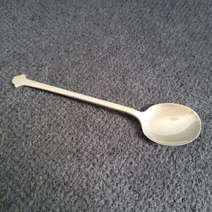 Antique sterling silver spoon made by Cooper Brothers & Sons