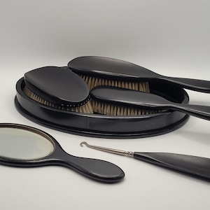 Elegant antikt groomingset tillverkat av äkta ebenholts
