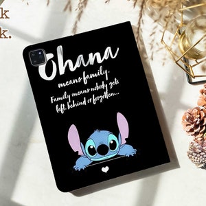 May include: Black phone case with a blue Stitch character peeking out from the bottom. The case has white text that reads "Ohana means family. Family means nobody gets left behind or forgotten..."