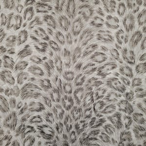 May include: A close-up of a fabric with a gray and white leopard print pattern. The fabric has a soft, fuzzy texture.