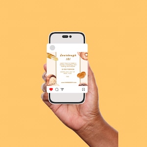 May include: A smartphone displays a social media post about a sourdough bread-making class. The post features watercolor illustrations of bread and the text "Sourdough 101" with details on learning techniques. The phone is held against a yellow background.