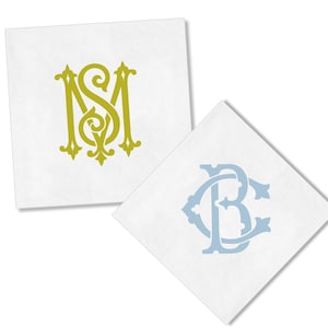 May include: Two white square napkins with custom monogram designs. One napkin features a gold-colored "MS" monogram, while the other displays a light blue "BC" monogram. The napkins are ideal for weddings, parties, or personalized gifts.