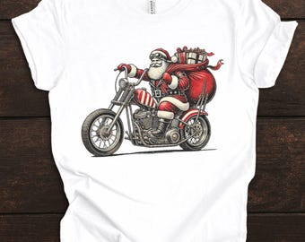 May include: White t-shirt featuring a graphic of Santa Claus riding a red and silver motorcycle, with a large red sack of gifts. The shirt has the text "WHITE" in a circle.