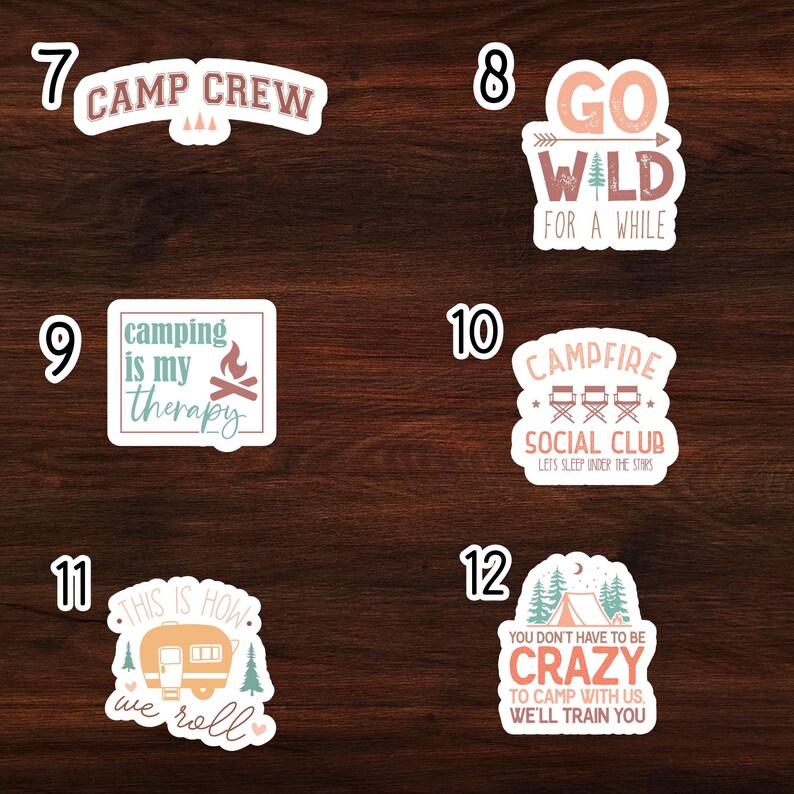 May include: Set of 6 camping themed stickers with various designs and text. The stickers feature phrases like "Camp Crew", "Go Wild for a While", "Camping is my therapy", "Campfire Social Club", "This is how we roll", and "You don't have to be crazy to camp with us, we'll train you".