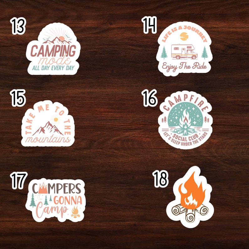 May include: Set of 6 camping themed stickers with various designs. The stickers feature a camper van, mountains, a campfire, and text that says "Camping Mode", "Take Me To The Mountains", "Campfire Social Club", and "Campers Gonna Camp".