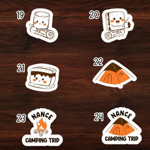 May include: Set of 6 camping themed stickers featuring a marshmallow, a s'more, a tent, and a campfire. The stickers are white with black outlines and feature a cute cartoon style. The stickers are numbered 19 through 24.
