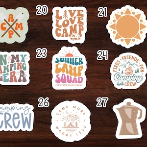 May include: Set of 9 camping themed stickers with various designs and colors. The stickers feature phrases like "Live Love Camp", "Summer Camp Squad", and "Camping Crew".