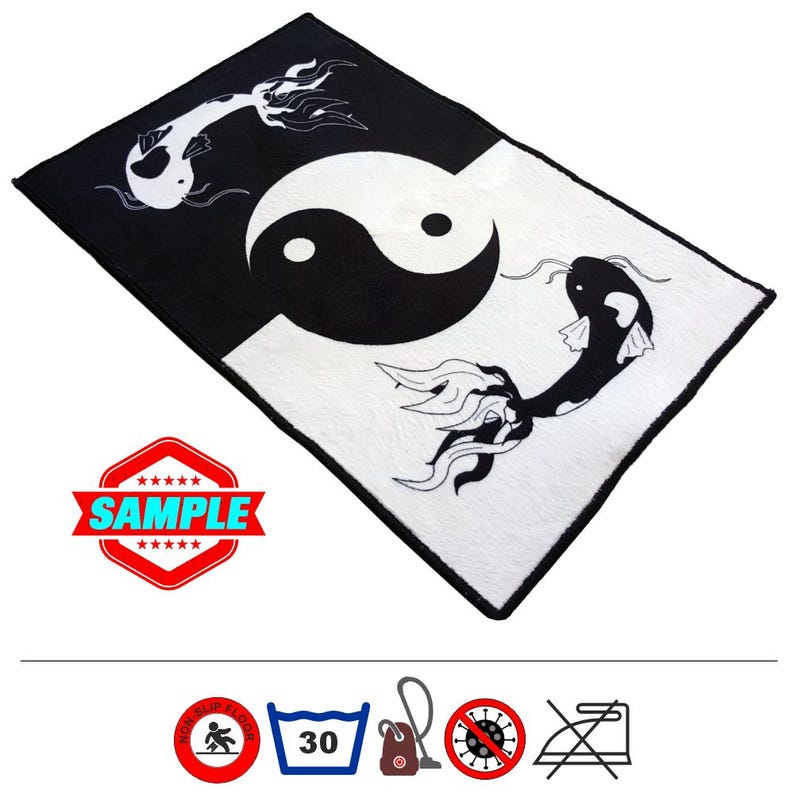 May include: Black and white rug with a yin yang symbol and two koi fish. The rug has a black border and is made of a soft, plush material.