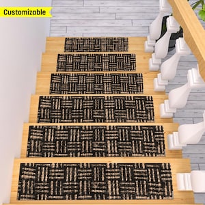 May include: Set of five black and beige patterned stair treads. The treads are made of a woven material and have a non-slip surface. The treads are shown on a wooden staircase.