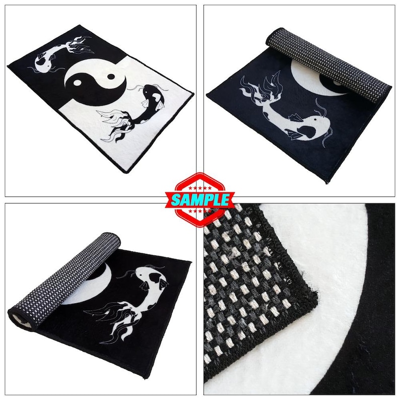 May include: Black and white rug with a yin yang symbol and two fish designs. The rug is rolled up in the image.