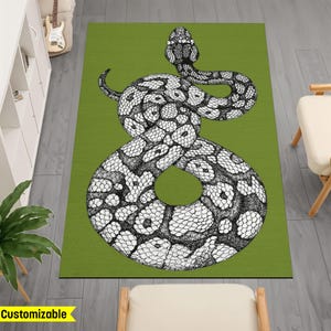 May include: A green rug featuring a black and white illustration of a snake. The snake is coiled in a figure of eight shape.