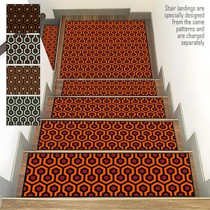 May include: A set of five stair treads featuring a geometric pattern in shades of orange, red, and black. The treads are designed for use on stairs and landings. Stair landings are specially designed from the same patterns and are charged separately.