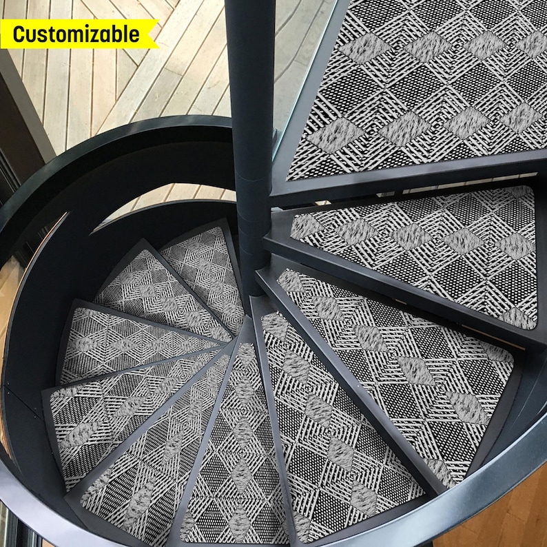 May include: Black and white patterned stair treads for a spiral staircase. The treads are made of a durable material and are designed to provide traction and safety. Customizable.