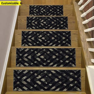 May include: Stair treads featuring a geometric diamond pattern in black and beige. The treads are fitted on wooden stairs with a natural finish. The word "Customizable" is in a yellow banner in the top left corner.
