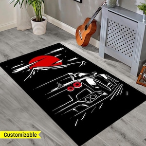 May include: Black and white illustration of a sports car driving on a road with a red sun and mountain in the background. The car is silhouetted against a black background.