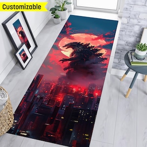 May include: A red and black rug with a Godzilla monster illustration standing in front of a city skyline with a red moon in the background.