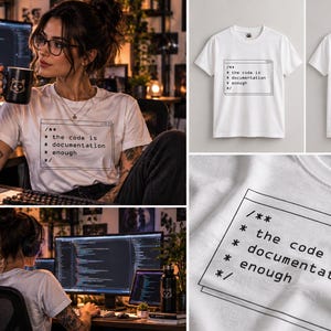 May include: A white short-sleeve t-shirt featuring a black graphic print of a computer code comment block. The text inside the box reads: /** * the code is * documentation * enough */. The shirt has a crew neckline and a plain white back.