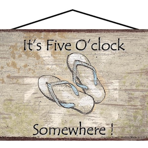 May include: A rustic wooden sign with a distressed white background and brown text. The sign reads "It's Five O'clock Somewhere!" and features a pair of flip-flops drawn in brown and blue.