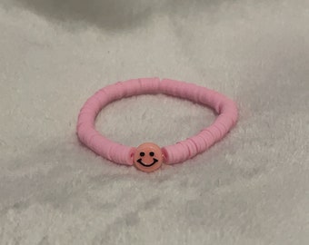 Light pink smiley face.