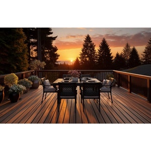May include: A wooden deck with a black dining table and chairs set against a sunset backdrop. The deck has a wooden railing and is surrounded by trees.