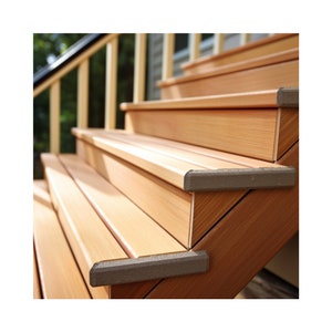 May include: Close-up of wooden steps with brown rubber edging. The steps are made of light brown wood and have a natural finish. The rubber edging is a dark brown color and provides a non-slip surface.
