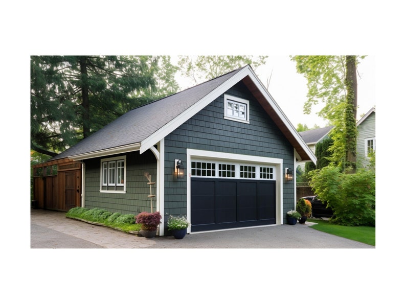 May include: A detached garage with a black garage door and white trim. The garage is painted a dark green color and has a small window above the door. The garage is surrounded by trees and bushes.