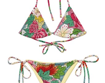 May include: A floral print bikini with a triangle top and a tie-side bottom. The top and bottom have a yellow lining and the print features pink, red, green, and yellow flowers.