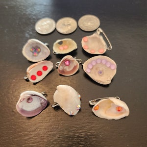 Small rhinestoned seashell pins (each sold separately)