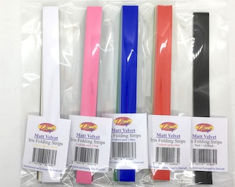 May include: Five packages of Matt Velvet Iris Folding Strips in white, pink, blue, red, and black. Each package contains 5 strips of paper.