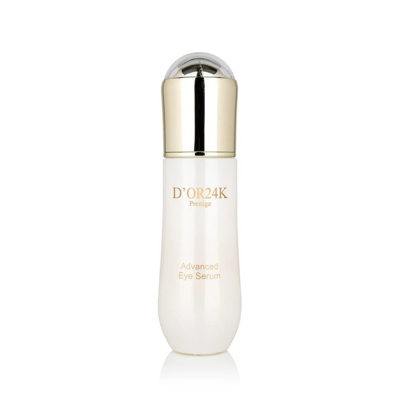 May include: A white bottle with a gold cap and a gold label that says "D'OR24K Prestige Advanced Eye Serum".