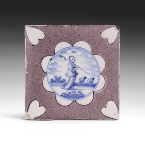 Dutch Delft manganese and blue tile, shepherdess and sheep, 18th century. Antique.
