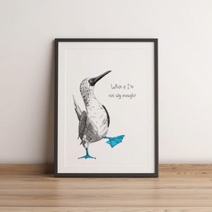 May include: Framed art print featuring a whimsical illustration of a blue-footed booby bird in a playful pose. The bird is depicted in black and white with blue feet. The text "What if I'm not silly enough?" is written in a handwritten style.