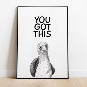 May include: Black framed art print with the text "YOU GOT THIS" above a detailed black and white illustration of a bird. The bird has a speckled head and a white chest.
