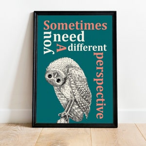 May include: A teal blue poster with a black frame features a black and white illustration of an owl with the text "Sometimes you need a different perspective" in white and coral pink.