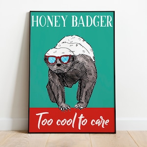May include: A poster with a cartoon illustration of a honey badger wearing sunglasses. The background is teal green and the text reads "Honey Badger Too Cool To Care" in white letters.