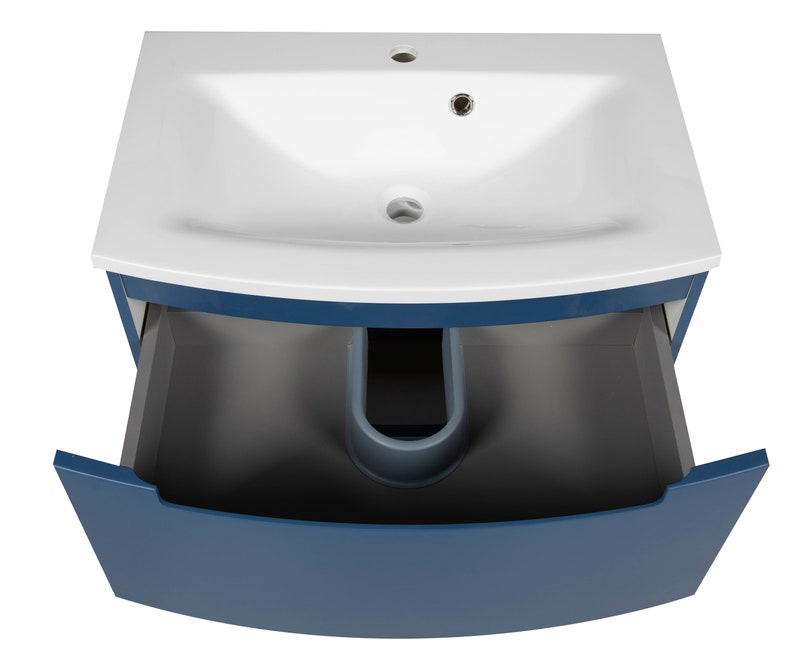 Puede incluir: Un lavabo de ba&ntilde;o de cer&aacute;mica blanca con un gabinete azul y un caj&oacute;n. El caj&oacute;n est&aacute; abierto y el interior es gris.