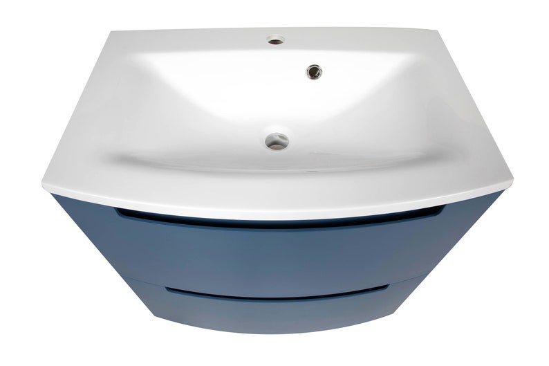 Puede incluir: Un lavabo de cer&aacute;mica blanco con un gabinete azul con dos cajones. El lavabo est&aacute; montado en la parte superior del gabinete.