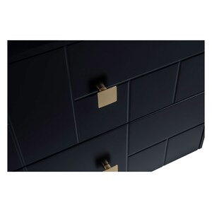 May include: Black chest of drawers with two drawers and gold square handles.